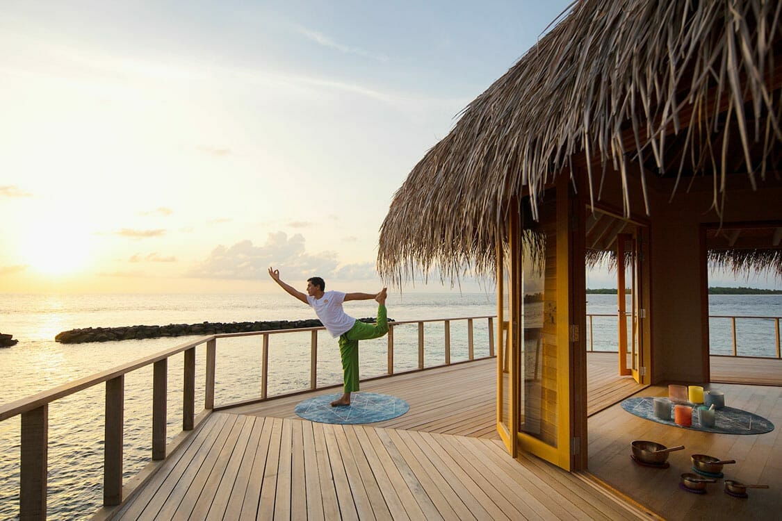 Man doing Yoga at the Yoga Pavilion at sunrise