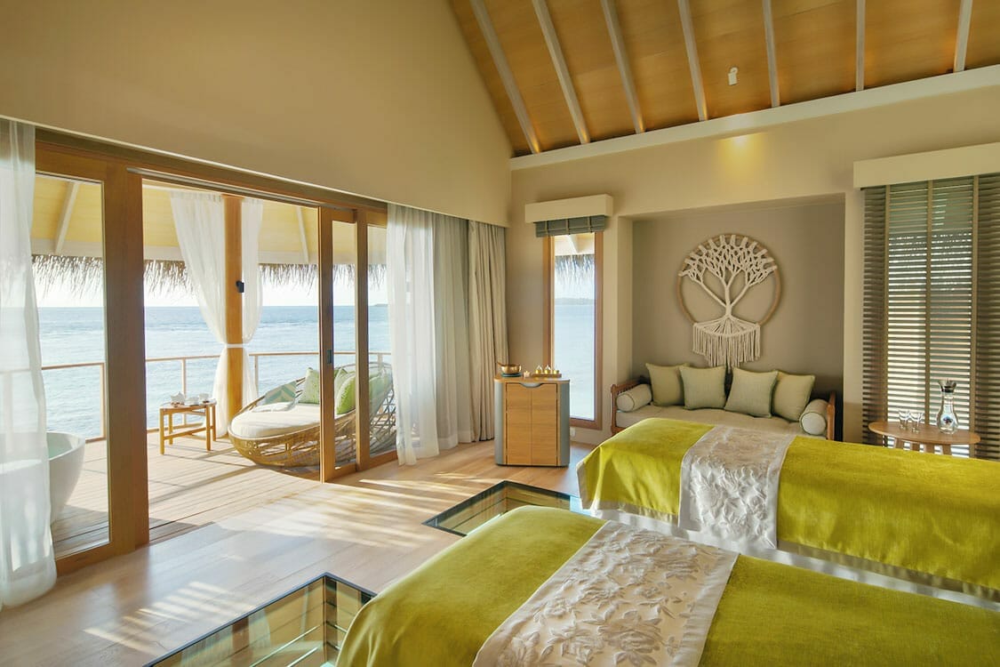 Interior of an overwater treatment room a the Solasta Spa, with stunning views of the ocean