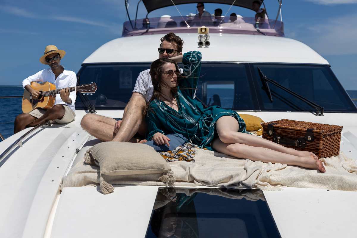 A couple lounging on a luxury yacht, on a cruise excursion from The Nautilus Maldives