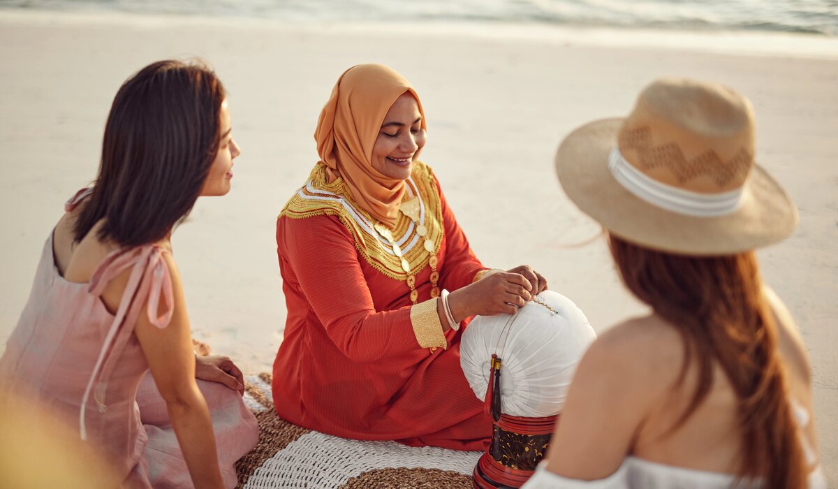 Local craftswoman demonstrating her craft on the beach at The Nautilus Maldives